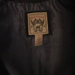 Mans Red Camel brand black puffy vest.